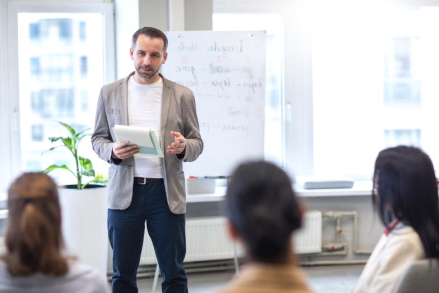 Student reviewing financial materials and taking notes
